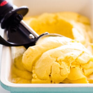 mango ice cream being scooped