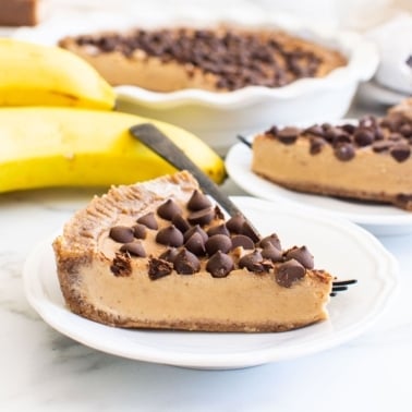 no bake peanut butter pie on plate with pie in background and bananas