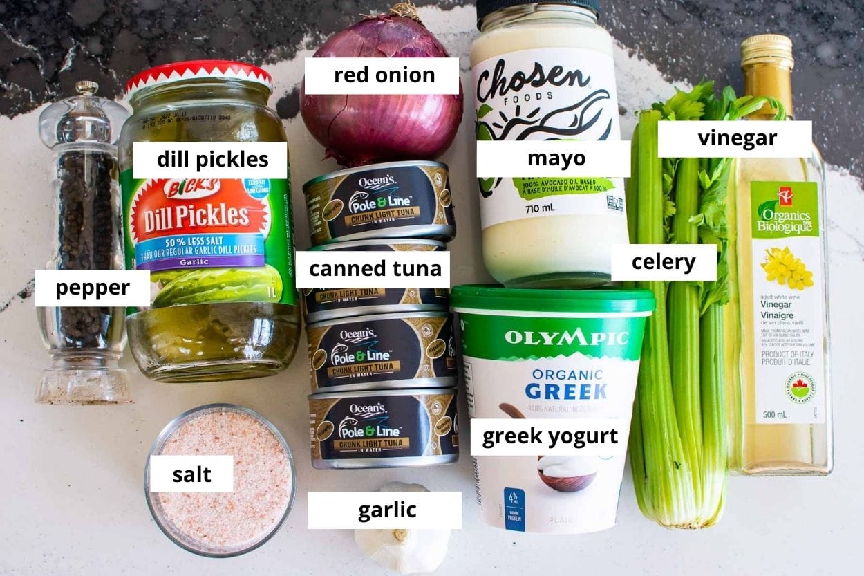 Canned tuna, yogurt, mayo, celery, red onion, pickles, garlic, vinegar, salt and pepper.