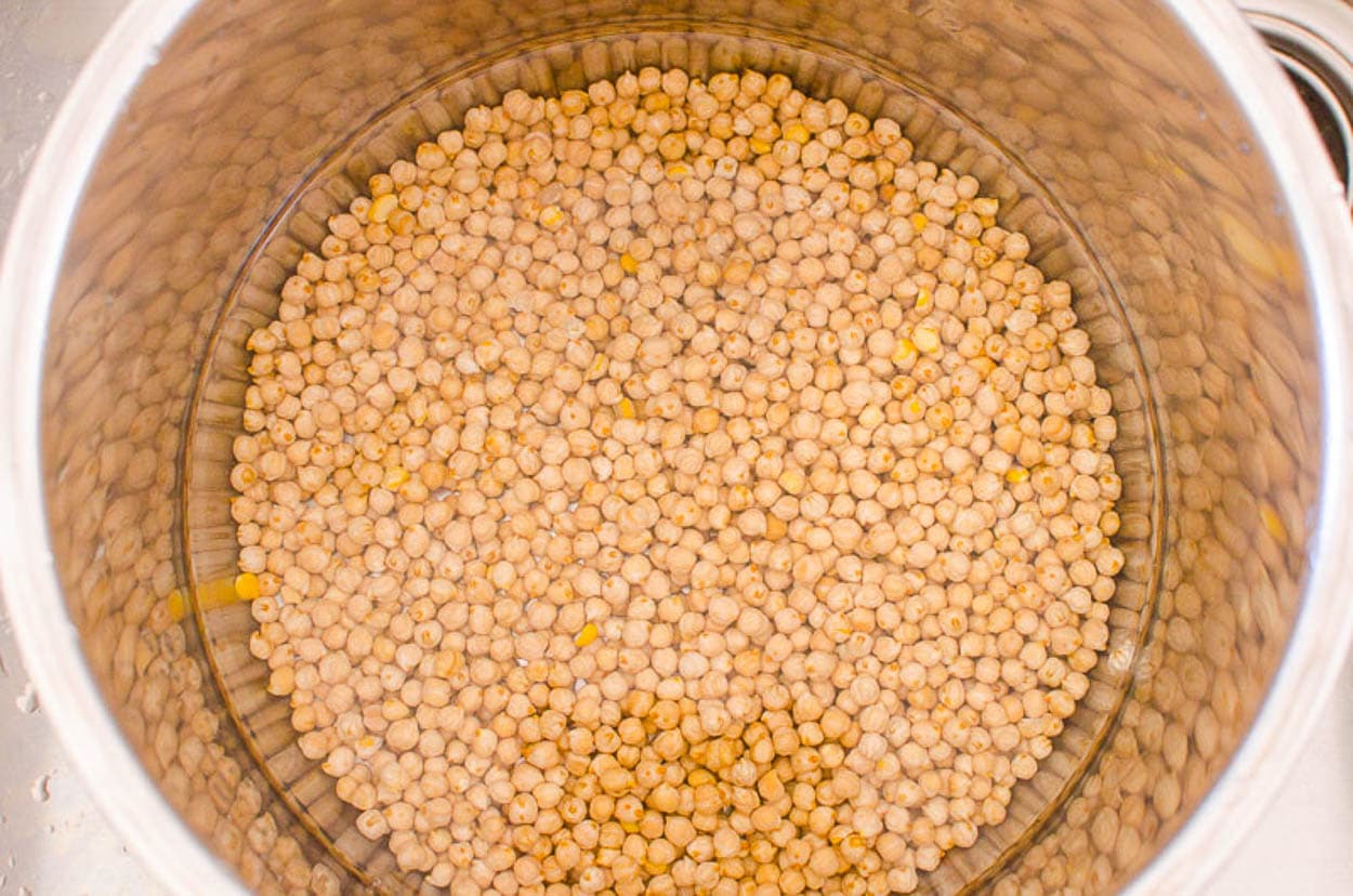 Water and dried chickpeas in Instant Pot. 