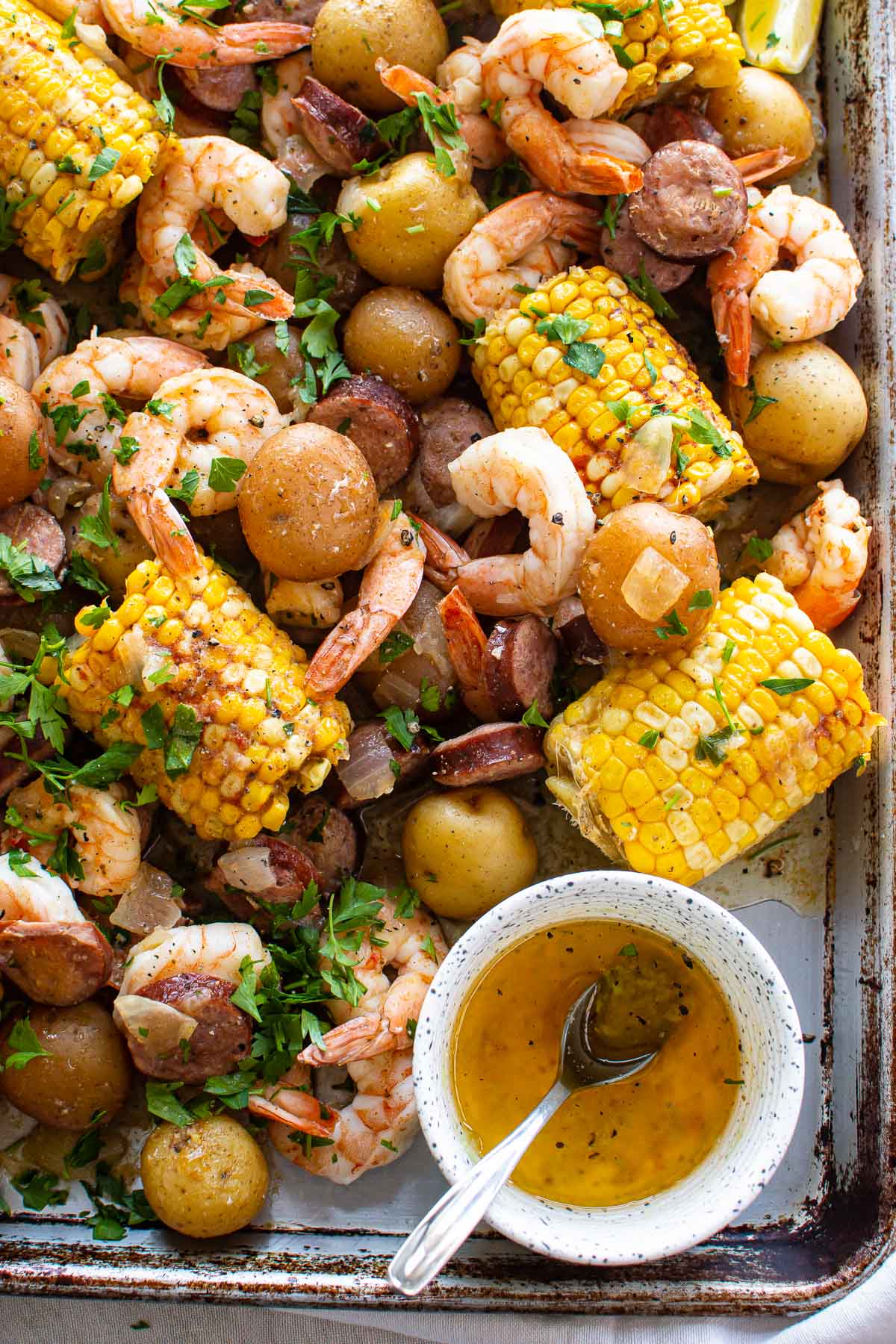 instant pot shrimp boil with corn on a platter with sauce