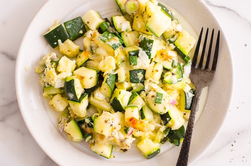 cooked zucchini and squash casserole recipe on plate with fork