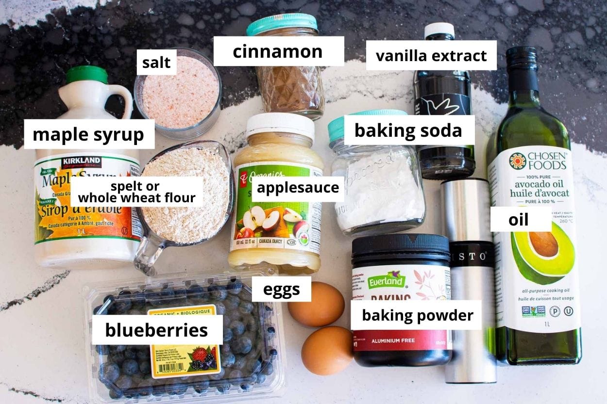 Blueberries, applesauce, baking powder and soda, whole wheat flour, eggs, cinnamon, salt, oil, maple syrup, vanilla, cooking spray.
