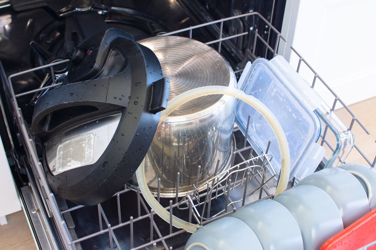 instant pot lid, pot, silicoen ring and trivet in a dishwasher