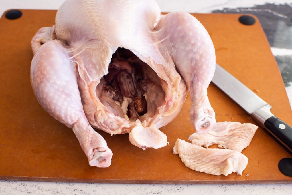 removing fat from the butt area of a chicken