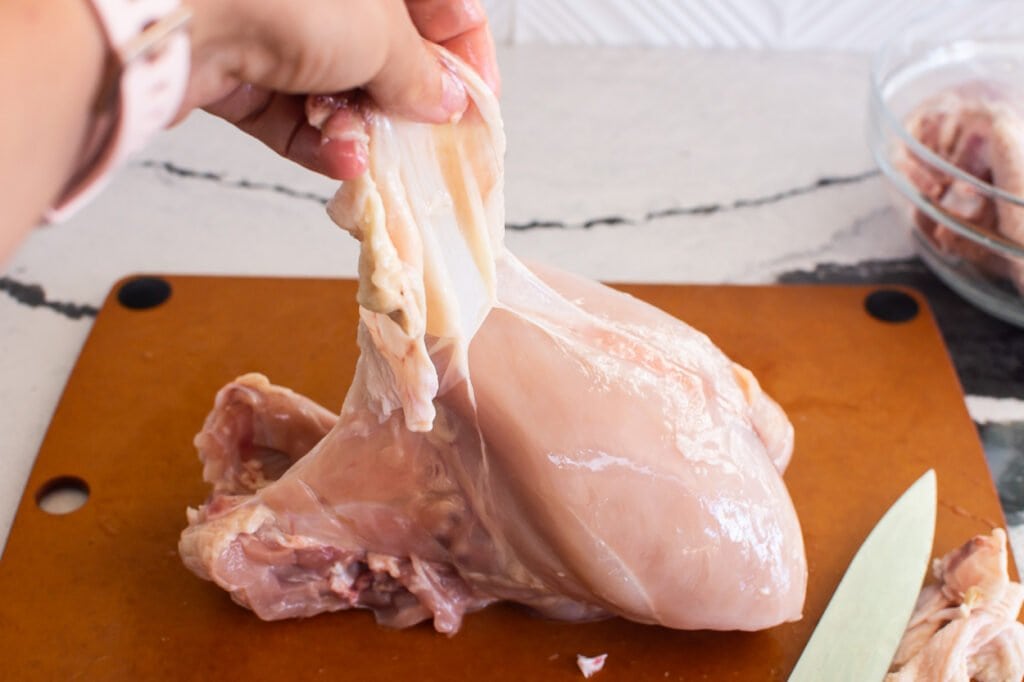 pulling skin away from whole chicken
