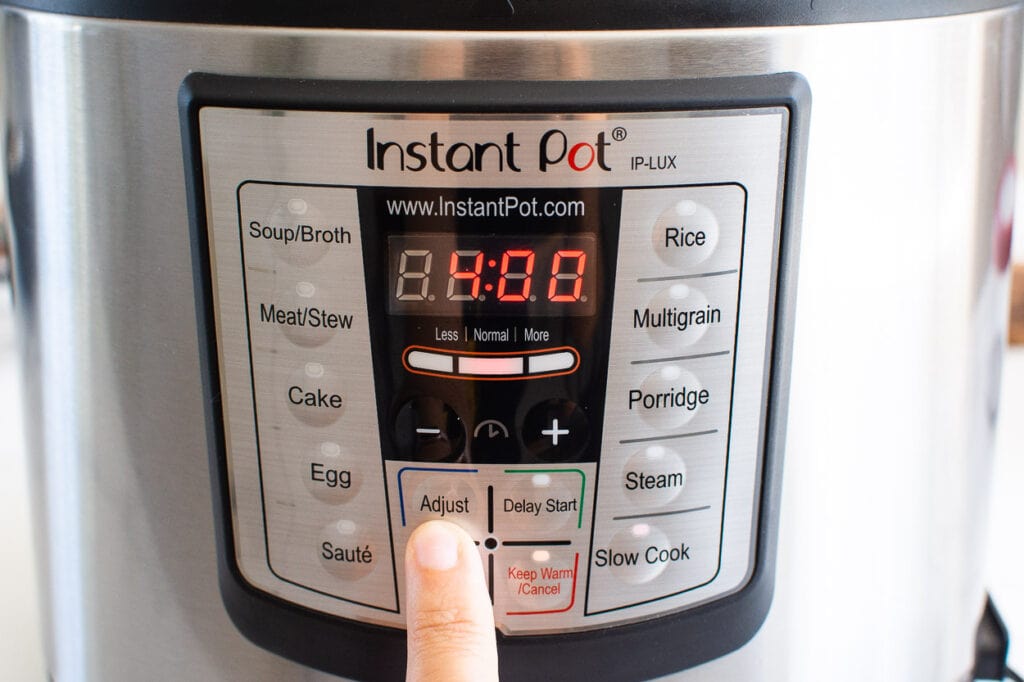 pressing adjust button on instant pot
