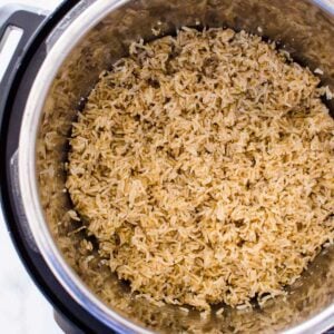 Instant Pot brown rice fluffed with a fork.
