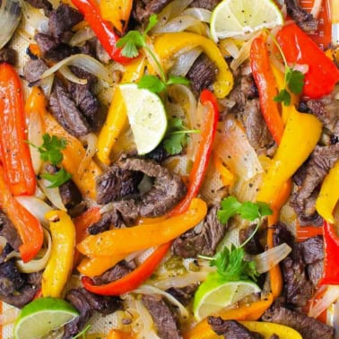 Sheet pan steak fajitas with lime and cilantro.