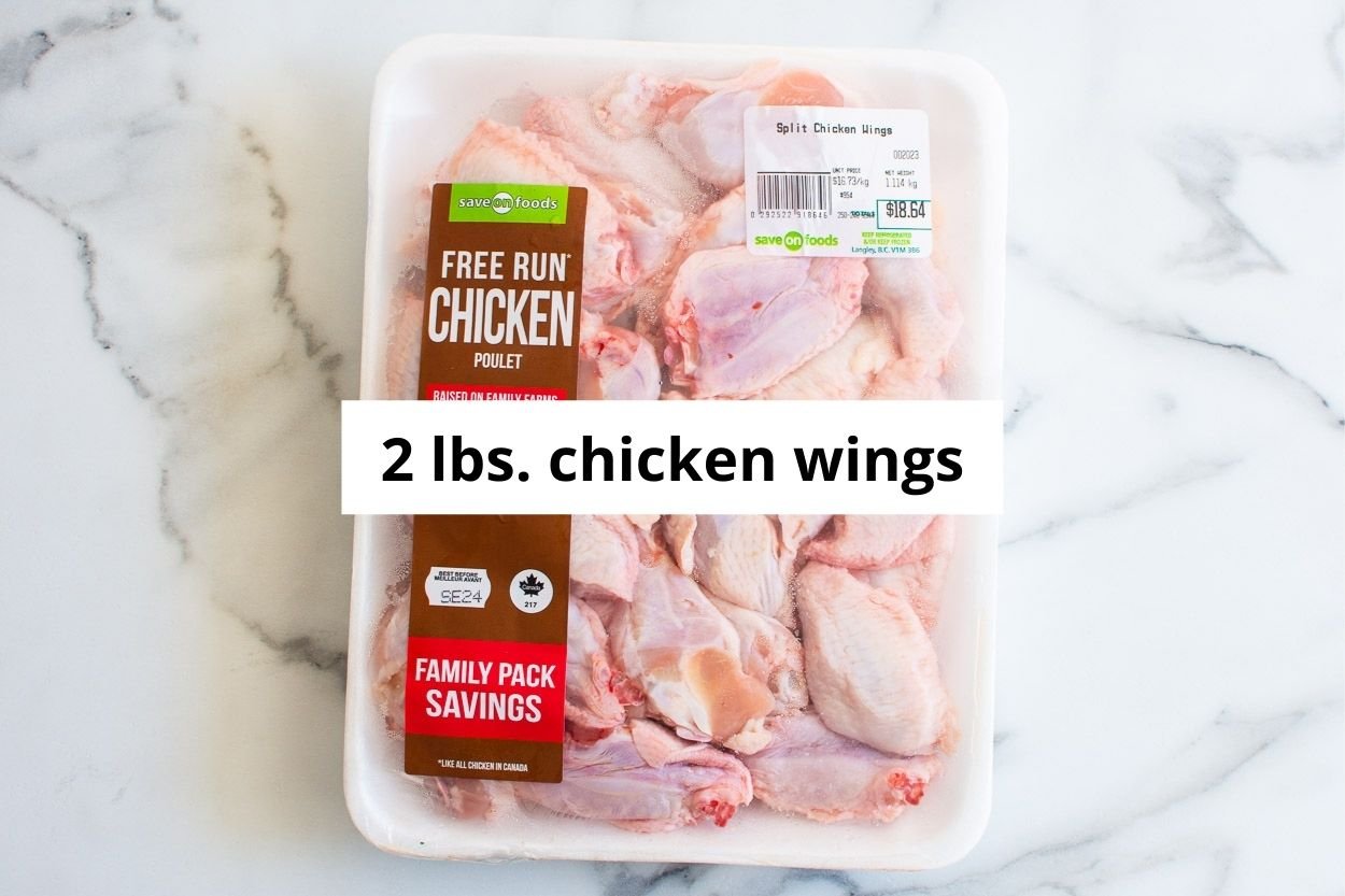 2 lbs of raw chicken wings in packaging.