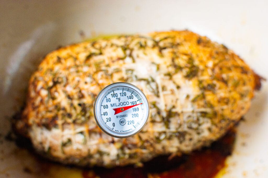 turkey breast with thermometer showing internal temp after resting