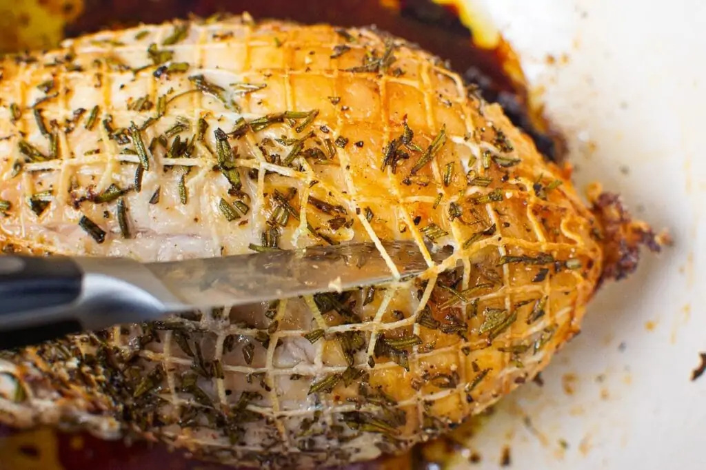 removing meat casing with sharp knife