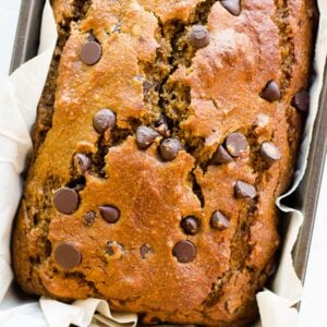 Healthy pumpkin chocolate chip bread in a loaf pan.