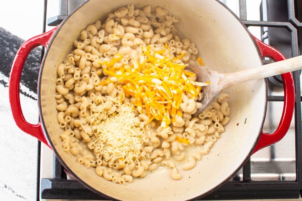 adding cheese to healthy macaroni and cheese