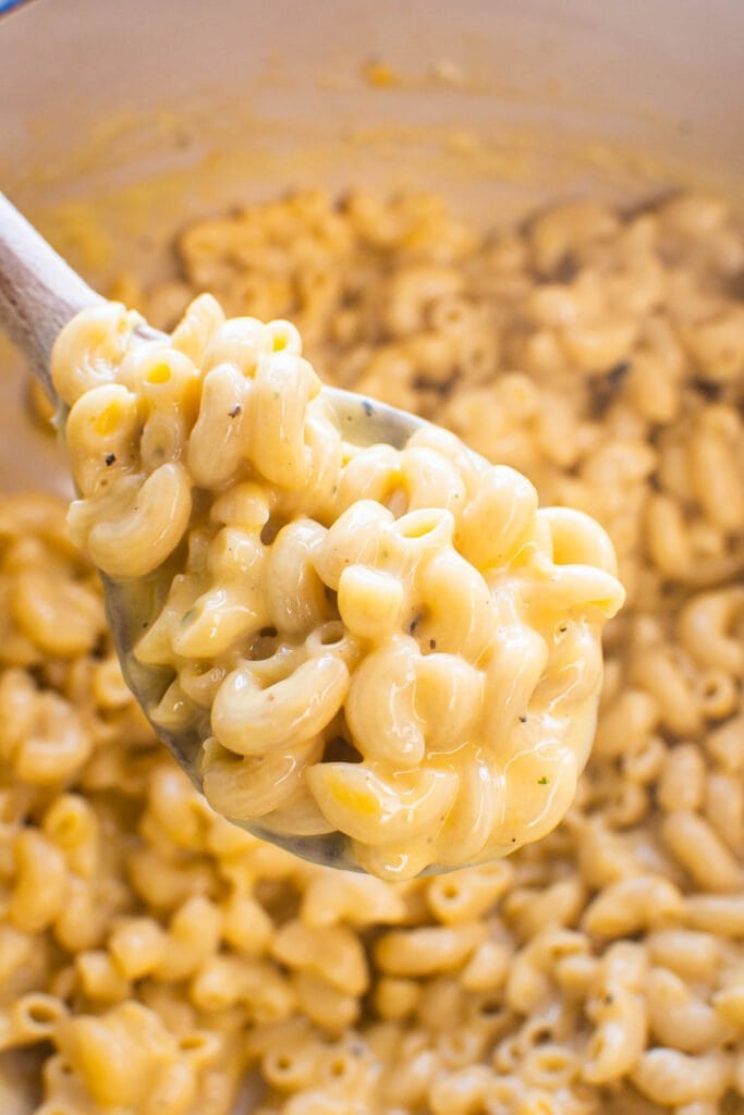 healthy mac and cheese on wooden spoon
