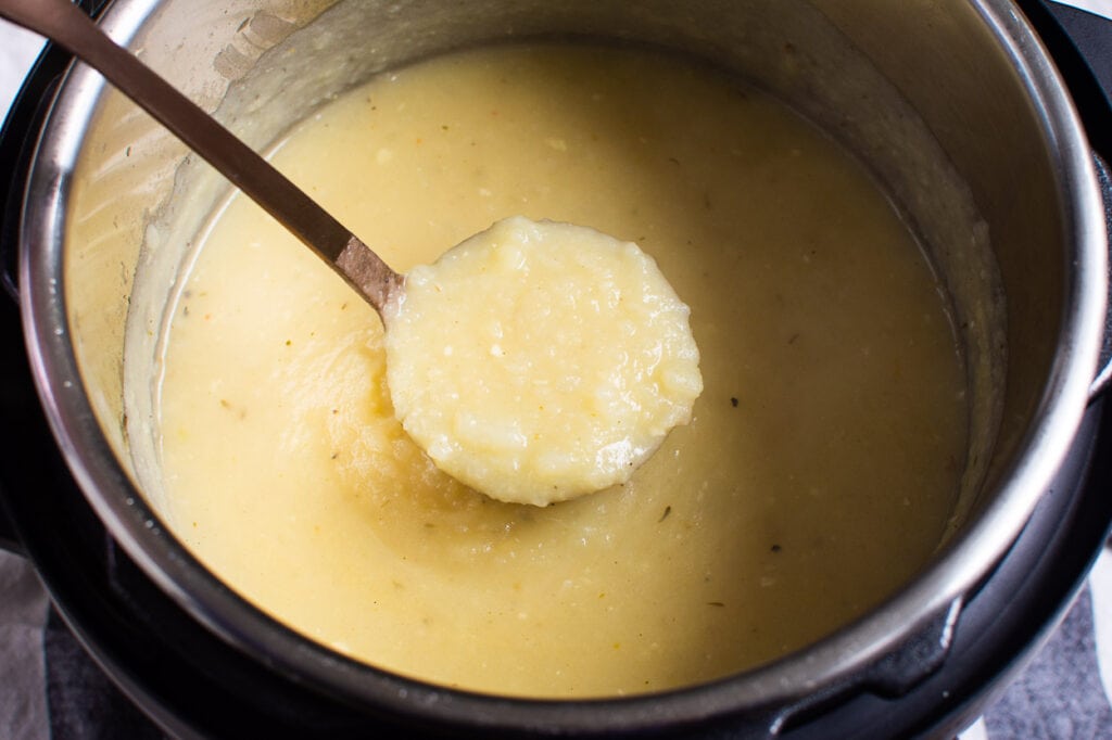Instant Pot potato soup on a ladle.