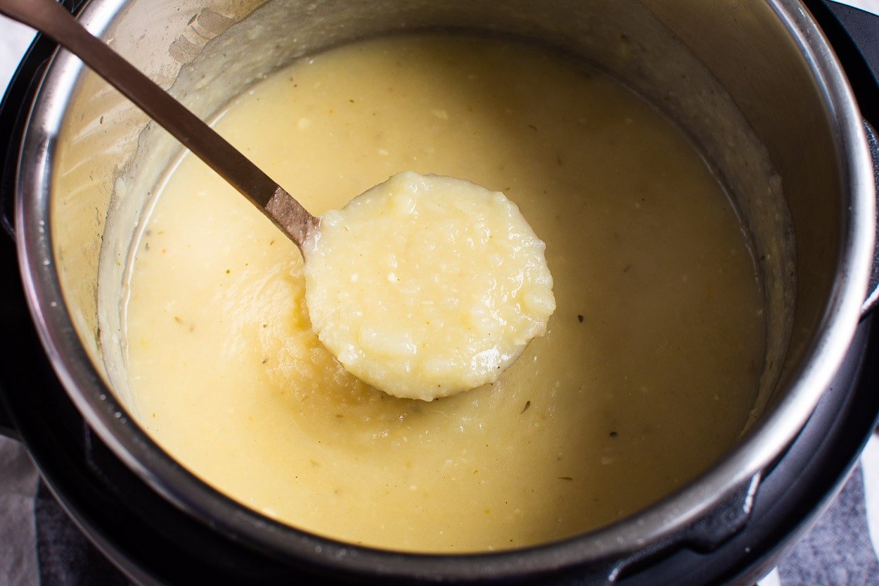 Instant Pot potato soup on a soup ladle.