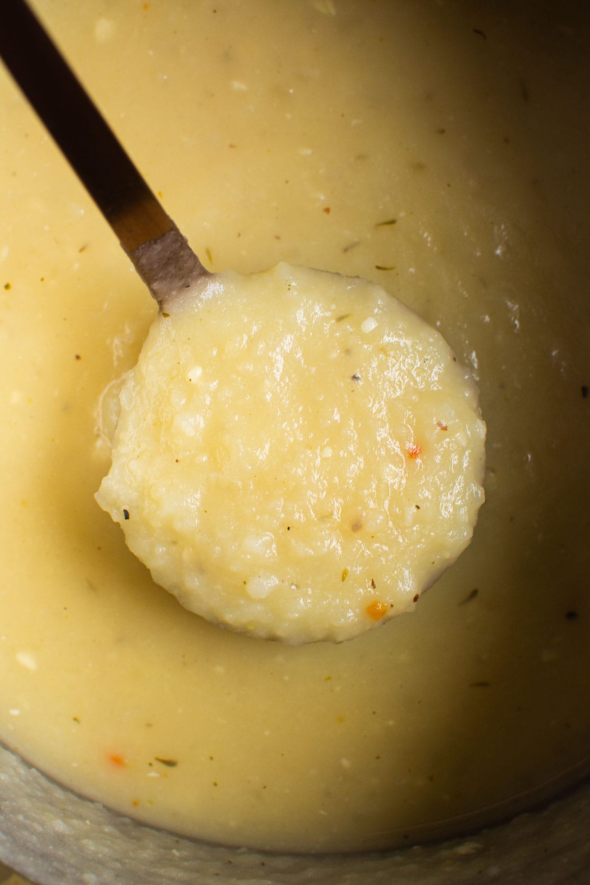 Instant Pot potato soup on a ladle.