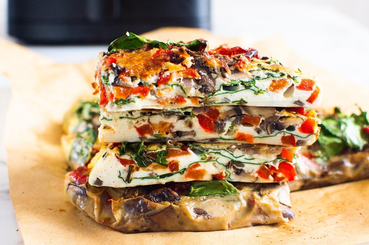 Air fryer frittata slices stacked on top of each other.