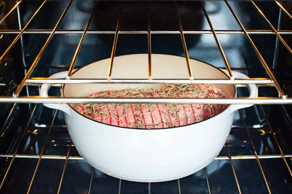 boneless leg of lamb roast in a pan in the oven