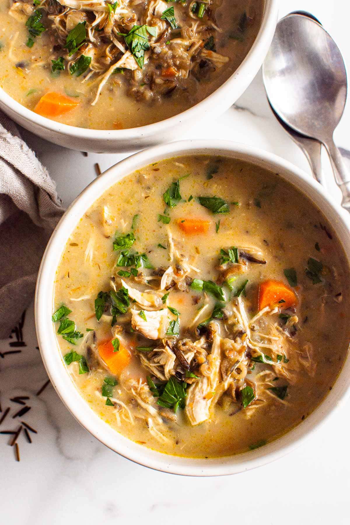 healthy chicken and wild rice soup in bowls