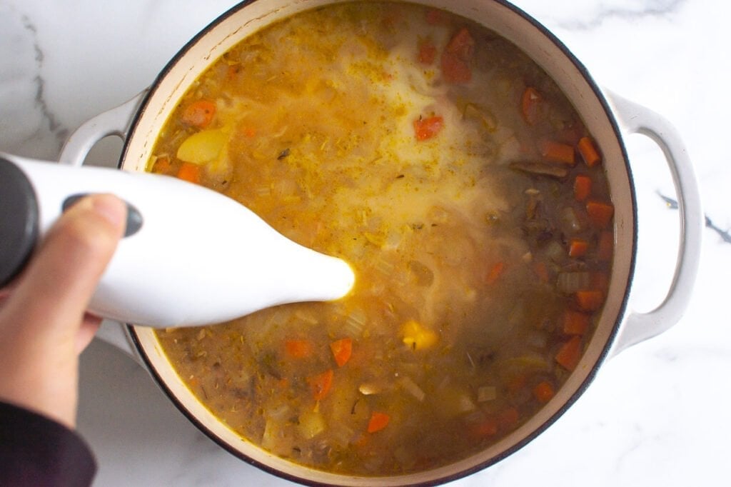 blending soup with immersion blender