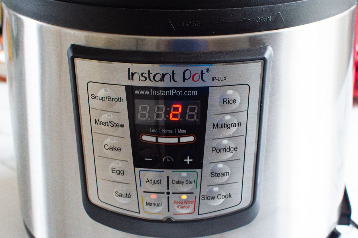 Instant Pot with manual button showing 2 minutes on display.