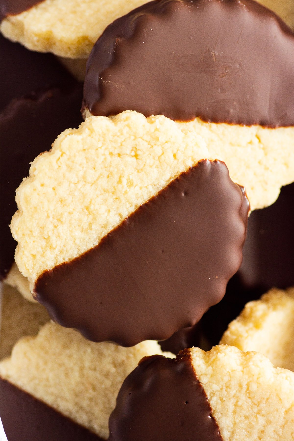 Closeup of almond flour shortbread cookies dipped in chocolate.