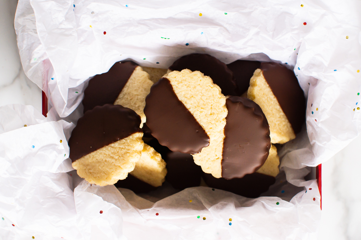 Sugar free chocolate dipped shortbread cookies in box with tissue.
