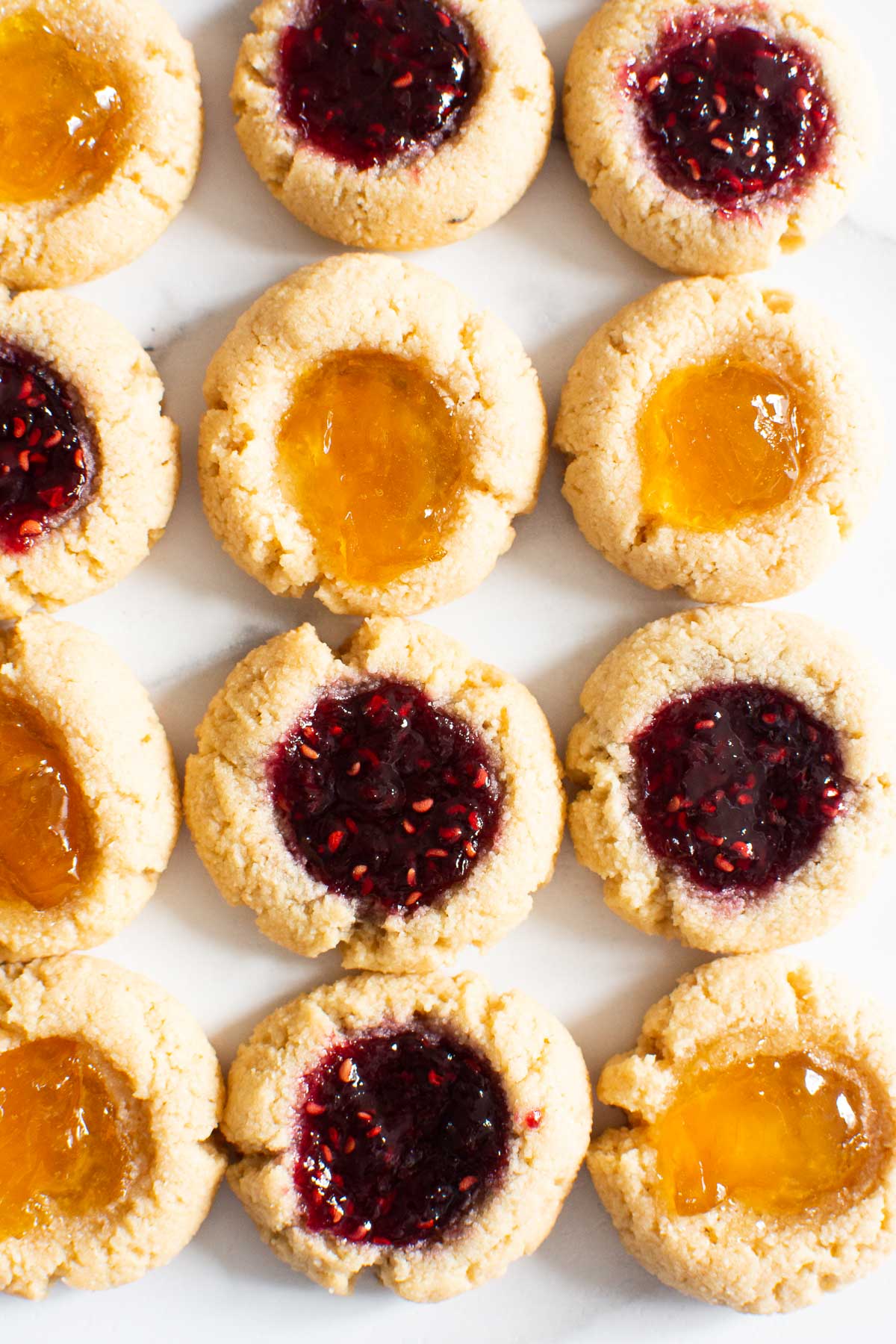 Almond flour thumbprint cookies with raspberry and peach jam.