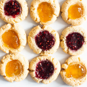almond flour thumbprint cookies with raspberry jam and peach jam