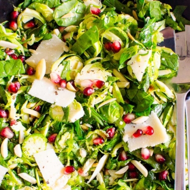 shaved brussels sprouts salad with nuts and pomegranate