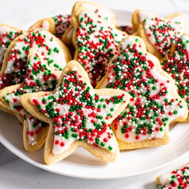 decorated healthy sugar cookies cut out into stars and shapes with icing and sprinkles