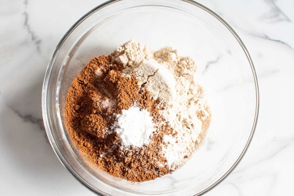 flour, cacao powder, leavening agents in a bowl