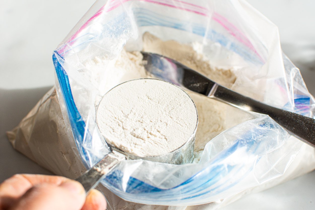 Cup filled with flour in a bag.