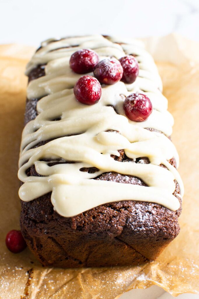 gingerbread loaf with glaze and cranberries