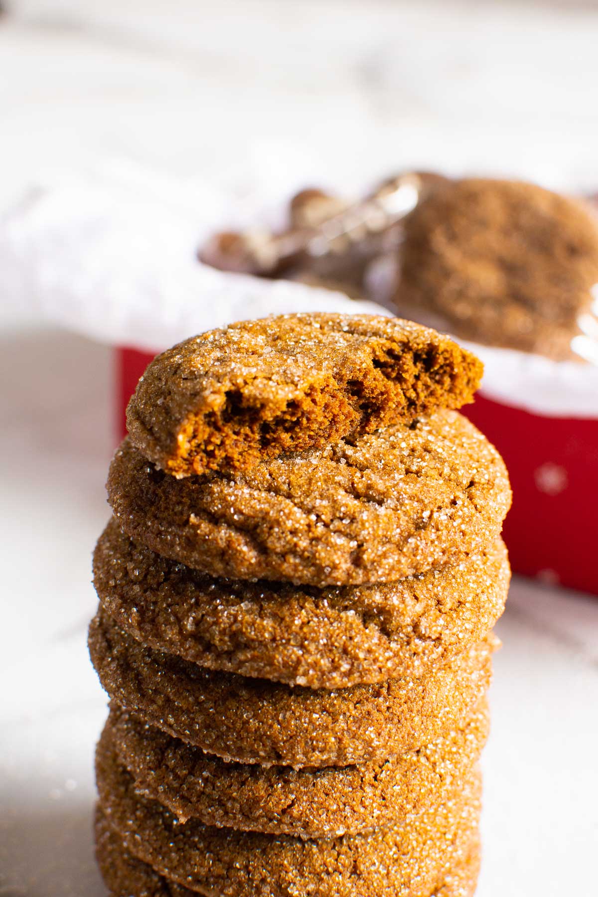 A stack of healthy gingersnap cookies with top cookie broke in half. 