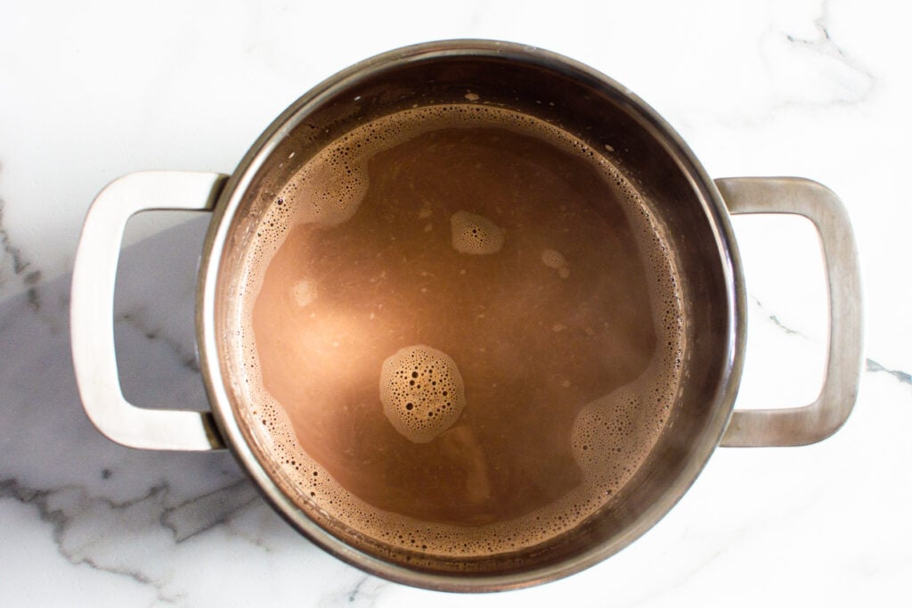 Healthy hot chocolate in saucepan.