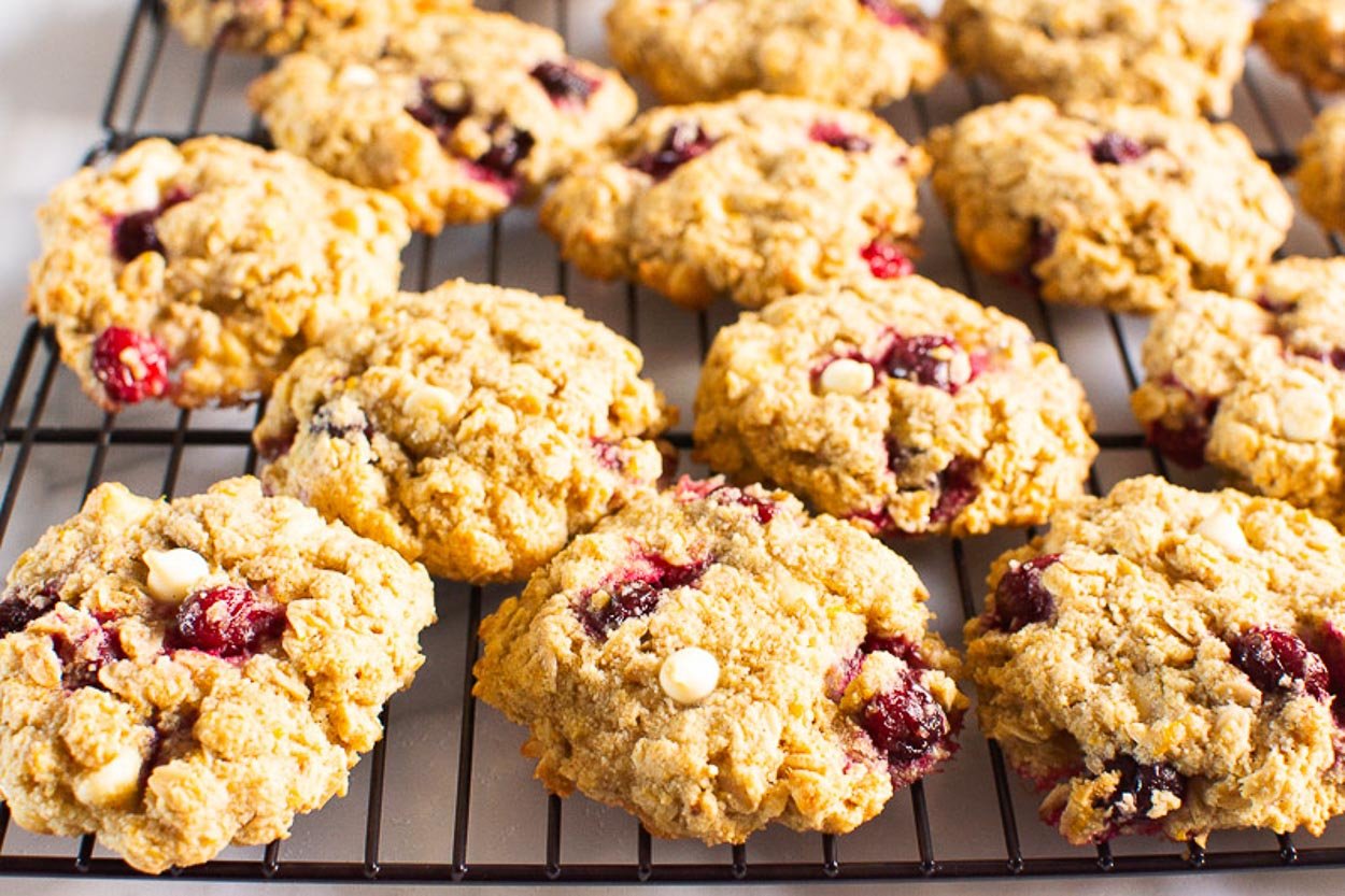 Healthy cranberry oatmeal cookies with chocolate chips finished on a baking rack.