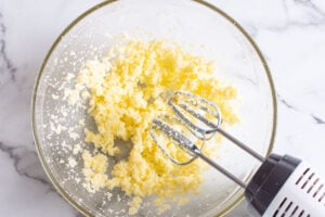 butter and sugar being mixed together