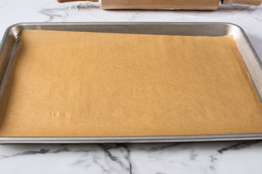 Parchment lined baking tray.
