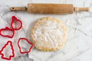 dusting sugar cookie dough with flour