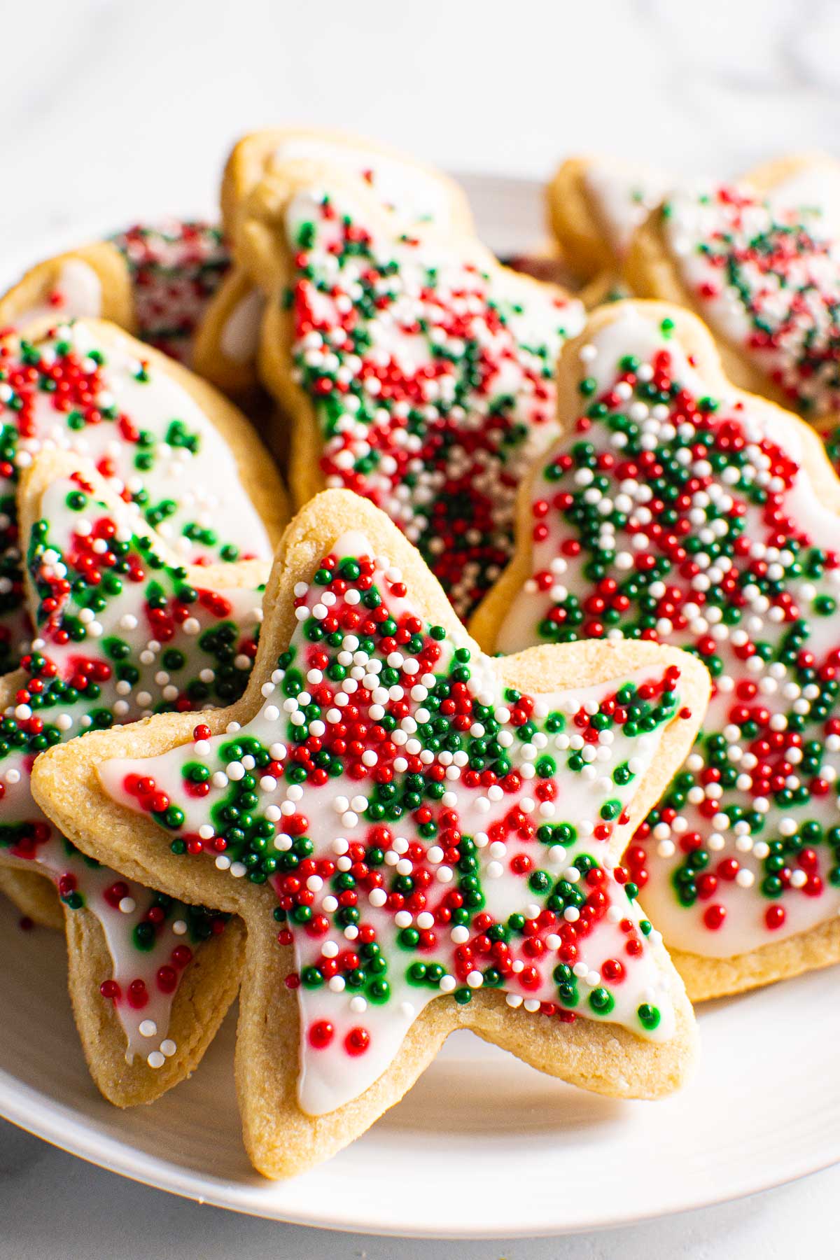 Decorated healthy christmas sugar cookies on a plate for serving.