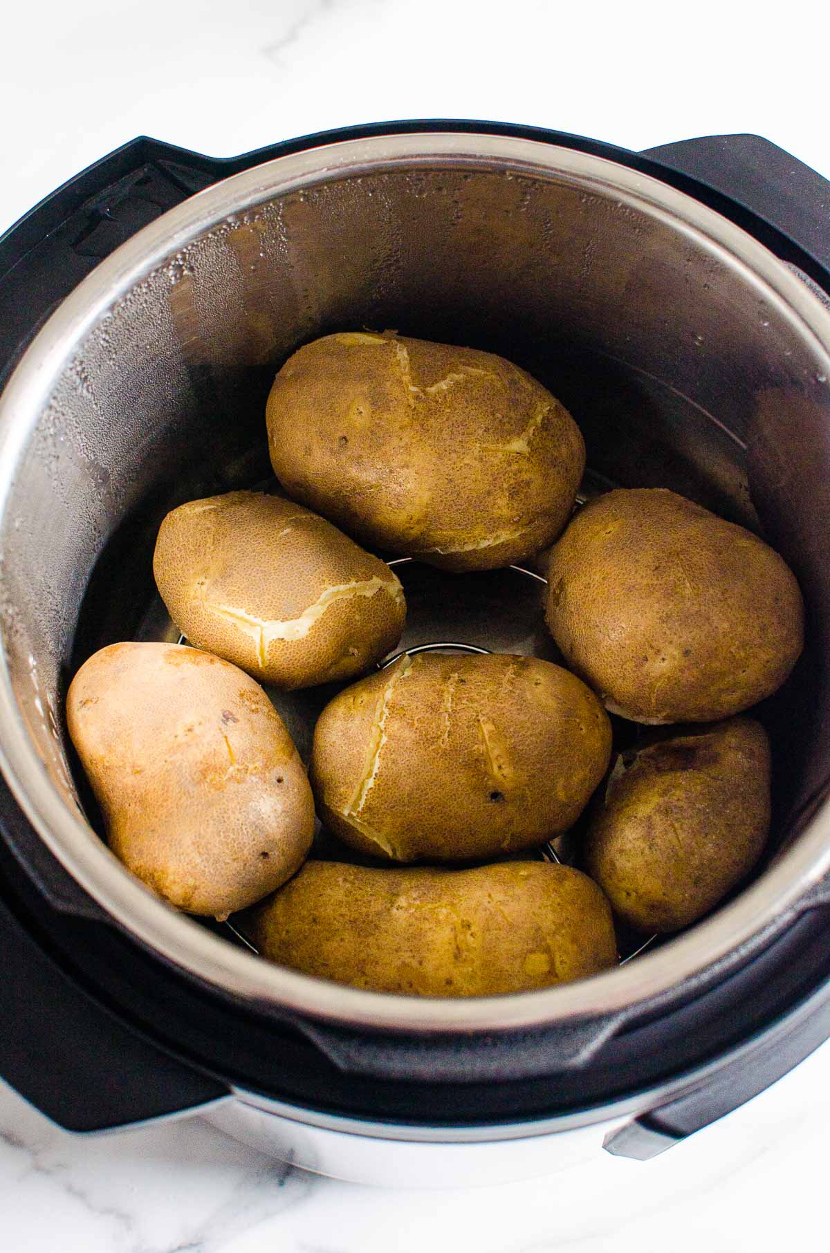 Seven cooked potatoes in the Instant Pot. 