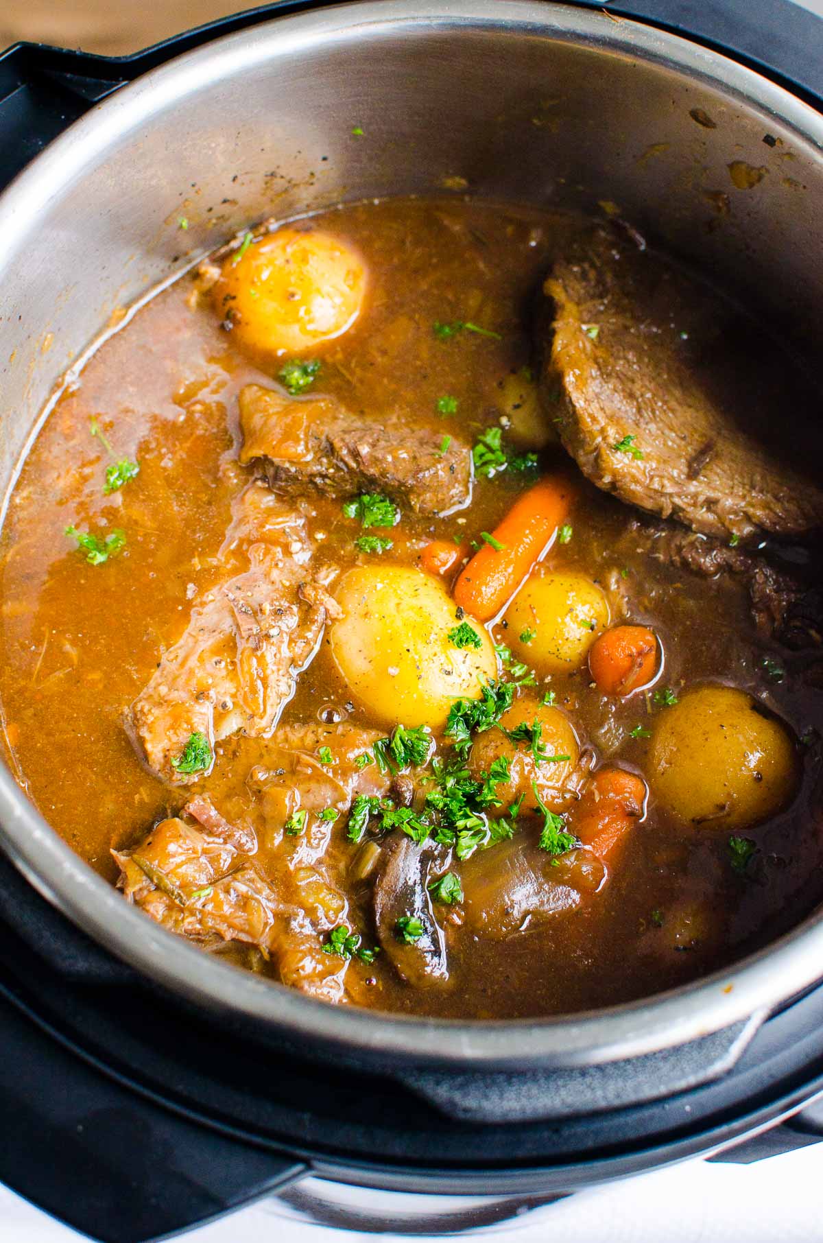 Instant Pot pot roast with baby potatoes and carrots.