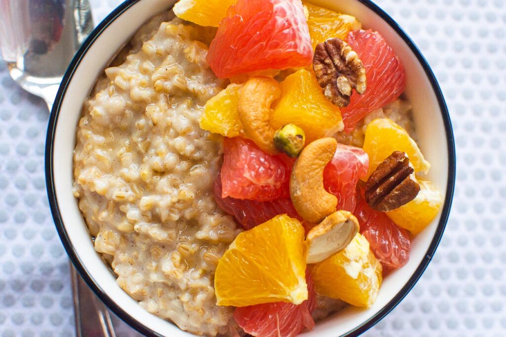 steel cut oatmeal made in instant pot ready to eat in a bowl with a spoon