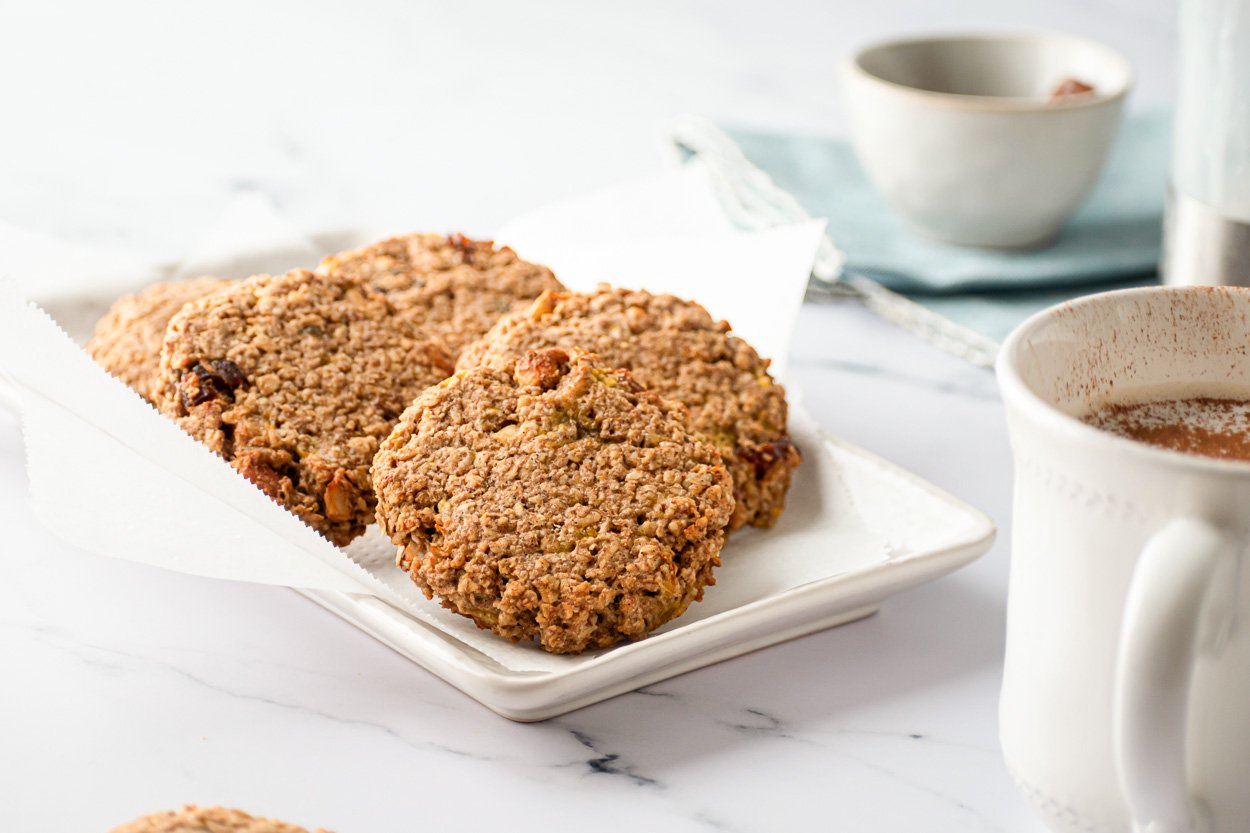 Sugar free oatmeal cookies on a platter with tea for serving.