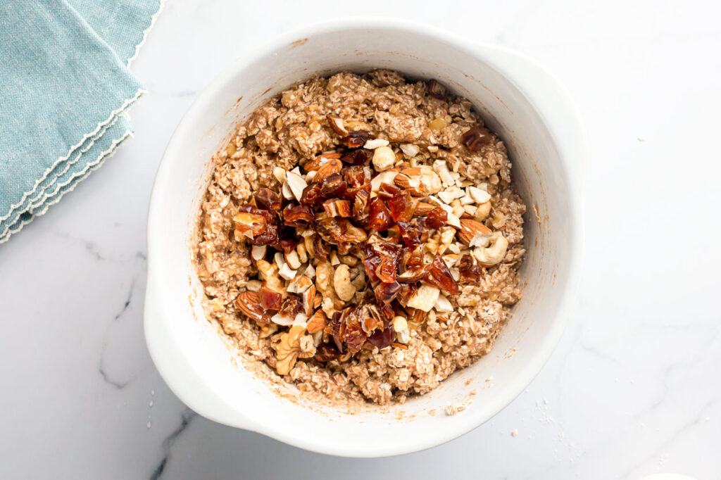 add nuts and dried fruit to oatmeal mixture