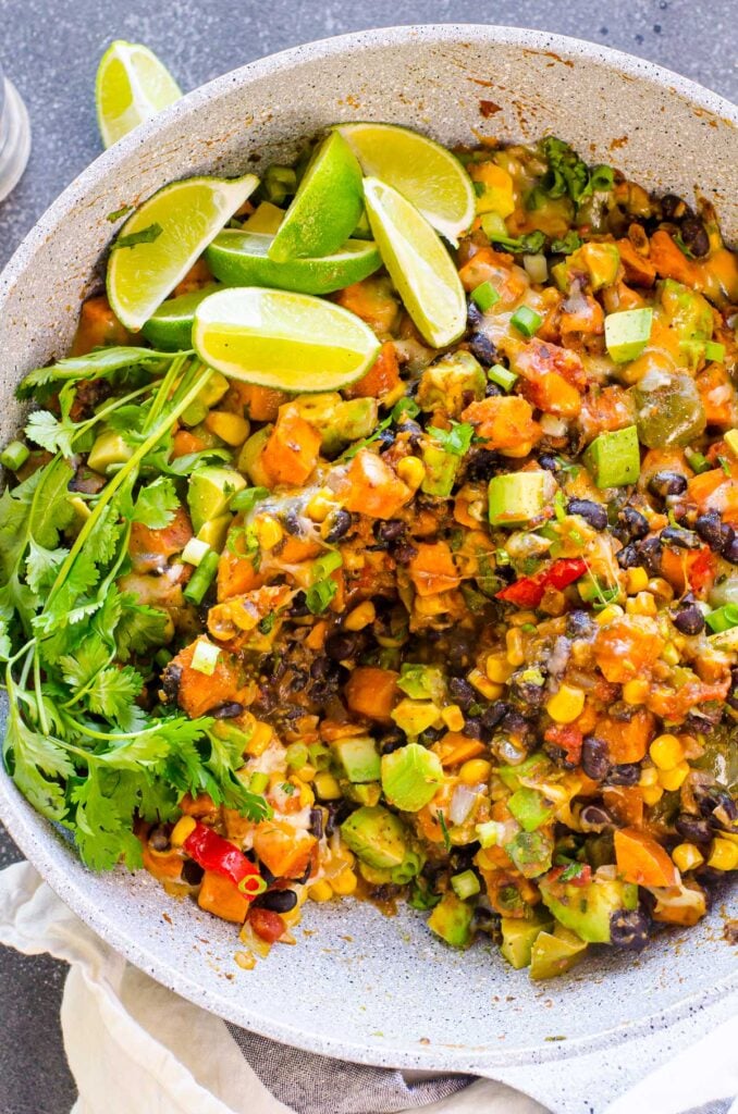 sweet potatoes in skillet with lime and beans tex mex spices