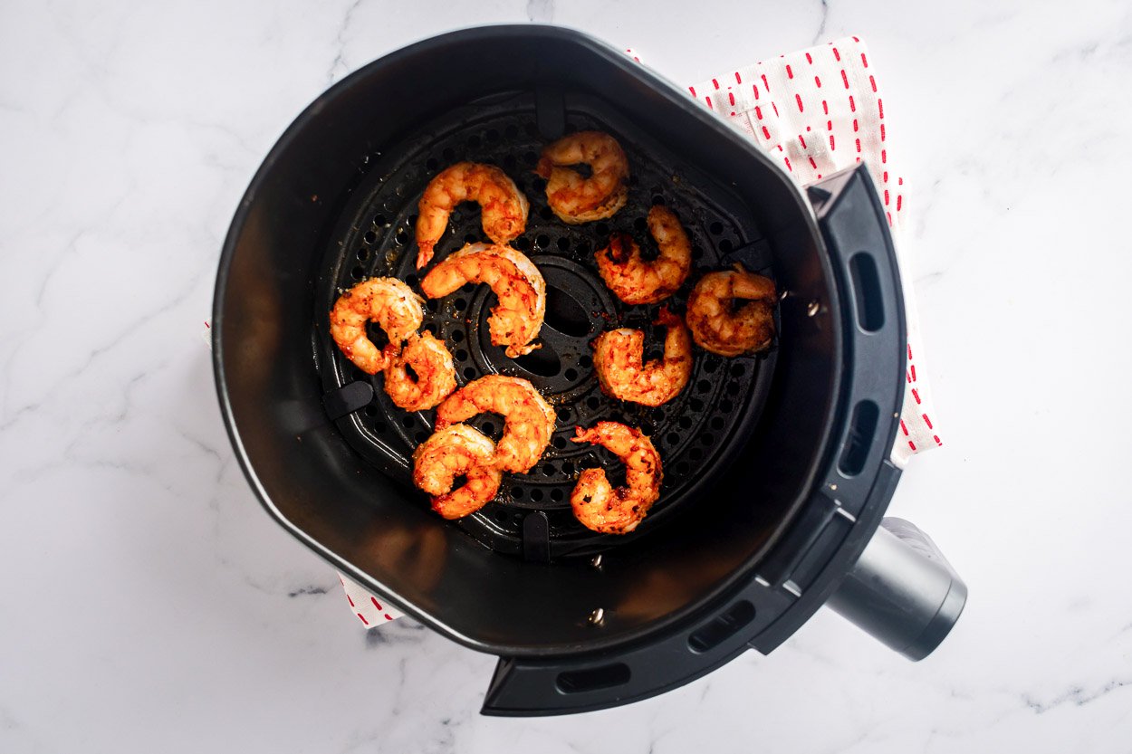 Air Fryer Shrimp" />
	
	
	
	
	
	
	
	
	
	
	
	
	
	{"@context":"https://schema.org","@graph":[{"@type":"Organization","@id":"https://ifoodreal.com/#organization","name":"iFoodreal","url":"https://ifoodreal.com/","sameAs":["https://www.facebook.com/iFOODreal/","https://www.instagram.com/ifoodreal/","https://www.pinterest.com/ifoodreal/","https://twitter.com/ifoodreal"],"logo":{"@type":"ImageObject","@id":"https://ifoodreal.com/#logo","inLanguage":"en-US","url":"https://ifoodreal.com/wp-content/uploads/2017/11/ifrLogo-1.png","contentUrl":"https://ifoodreal.com/wp-content/uploads/2017/11/ifrLogo-1.png","width":150,"height":37,"caption":"iFoodreal"},"image":{"@id":"https://ifoodreal.com/#logo"}},{"@type":"WebSite","@id":"https://ifoodreal.com/#website","url":"https://ifoodreal.com/","name":"iFOODreal.com","description":"","publisher":{"@id":"https://ifoodreal.com/#organization"},"potentialAction":[{"@type":"SearchAction","target":{"@type":"EntryPoint","urlTemplate":"https://ifoodreal.com/?s={search_term_string}"},"query-input":"required name=search_term_string"}],"inLanguage":"en-US"},{"@type":"ImageObject","@id":"https://ifoodreal.com/air-fryer-shrimp/#primaryimage","inLanguage":"en-US","url":"https://ifoodreal.com/wp-content/uploads/2021/12/fg-air-fryer-shrimp-recipe.jpg","contentUrl":"https://ifoodreal.com/wp-content/uploads/2021/12/fg-air-fryer-shrimp-recipe.jpg","width":1250,"height":1250,"caption":"air fryer shrimp in a bowl"},{"@type":["WebPage","FAQPage"],"@id":"https://ifoodreal.com/air-fryer-shrimp/#webpage","url":"https://ifoodreal.com/air-fryer-shrimp/","name":"Air Fryer Shrimp